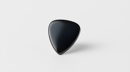 A black guitar pick with a rounded top and pointed bottom.