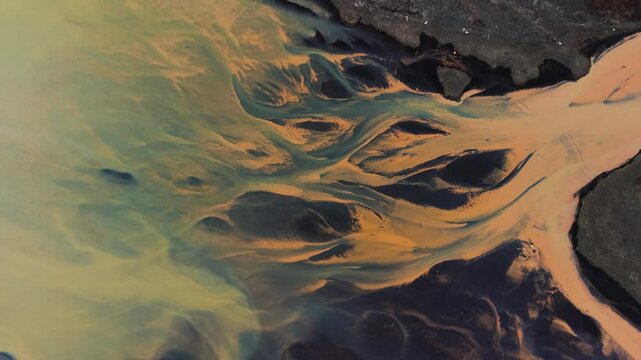 Exclusive Cinematic 4K Aerial Footage of Rare Yellow River Flowing Over Black Sand on South Coast of Iceland