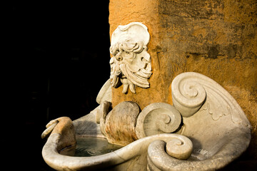 a small charming fountain in the Oltrarno district of Florence