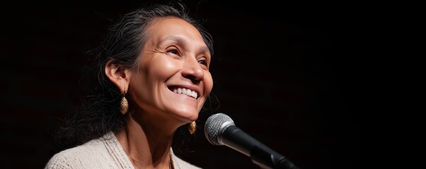 Senior latina trans woman at poetry event smiling confidently on stage