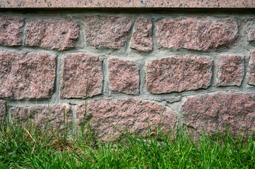 Rustic stone foundation showing textured masonry.