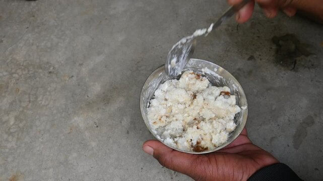 Flattened rice, curd and jaggery. In some regions of India, these three are mixed and eaten for breakfast. Eating this has special importance during the Indian festival Makar Sankranti.