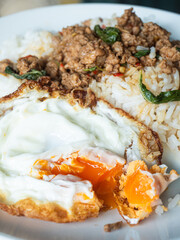 sunny side up egg, a must combination for Pad Kaprao, Thai stir fried minced pork with holy basil leaves