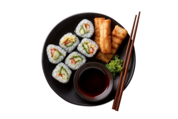 Top view of a Japanese food with sushi rolls, fried snacks, soy sauce, and chopsticks on a black plate, isolated on transparent background, ideal for food and restaurant visuals