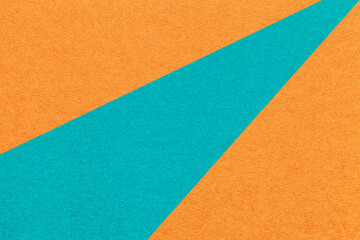 Fototapeta premium Abstract old geometric orange paper background with turquoise rays, macro texture for banner, template, presentation