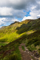 Puy Mary illuminated by a ray of light from the sources of the Jordanne