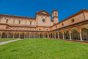  Ferrara, Italy - May 17, 2025: Saint Christopher church with its large garden and cloister, part of the monumental complex of the Charterhouse of Ferrara, a historic landmark and tourist attraction