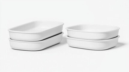 Four white bowls stacked on top of each other.