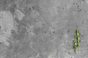 Gray concrete surface with spices and greenery