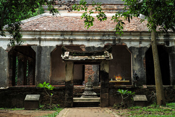 The old Buddhism church located in the forest surrounded by the trees