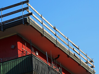 wooden planks of the sturdy protective barrier firmly installed for the safety of workers during...