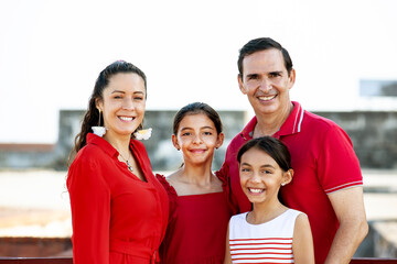 Young family of four traveling together. Family love concept. Travel concept. Cartagena de Indias.