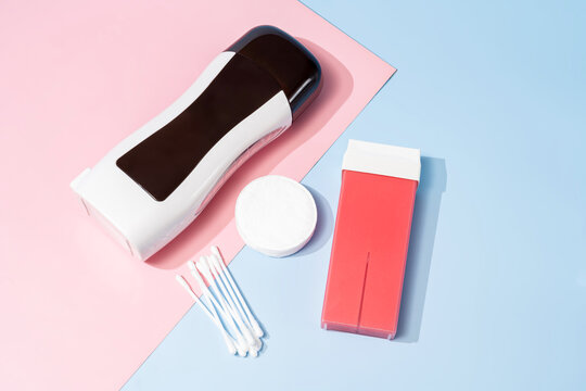 Roll on waxing supplies on pastel background