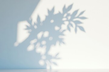 Obraz premium Abstract shadow of leafy tree branch cast on white wall , background, silhouette, natural