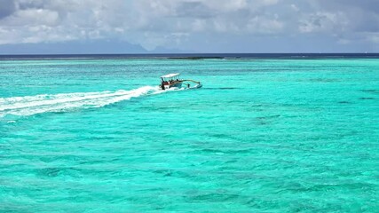 Drone aerial Tahiti. Aerial view of Bora Bora turquoise crystal clear water lagoon, tour sail boat. French Polynesia 4k. Luxury honeymoon vacation, romantic getaway, exotic resort destination. - Powered by Adobe