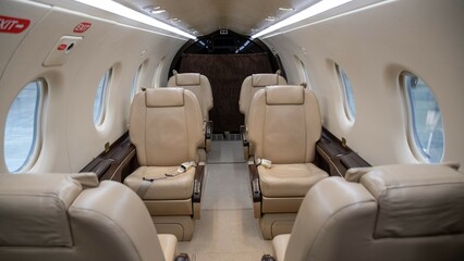 Luxury bright leather interior of a modern commercial airplane. Small business turboprop aircraft....