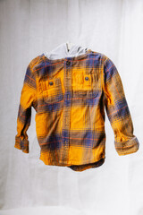 floating flannel hoodie on a linen backdrop