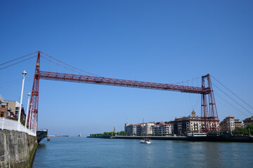 Vizcaya bridge connecting portugalete and getxo in basque country, spain, over the nervion river on a sunny day