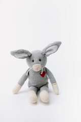 Mouse stuffed animal sitting on a white background