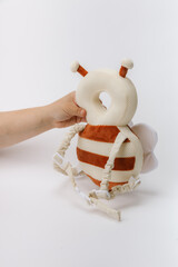 Baby bumblebee safety backpack on white background