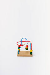 Sliding bead toy on white backdrop