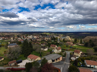 Aerial View of Countryside Village Under Cloudy Sky
