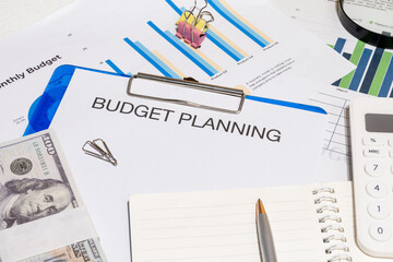 Budget Planning Documents with Graphs on Desk – Personal and Business Financial Forecasting...