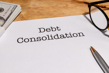 Debt Consolidation Documents with Cash on Desk – Financial Recovery and Loan Management Concept