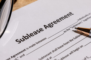 Sublease Contract Paperwork on Office Table – Real Estate and Legal Terms Concept