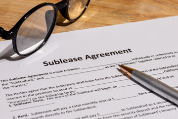 Sublease Contract Paperwork on Office Table – Real Estate and Legal Terms Concept