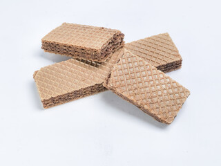 Delicious chocolate wafer cookies arranged on a plain white surface
