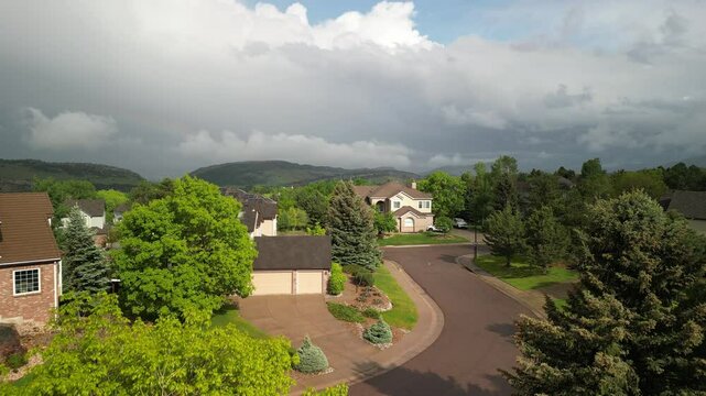 Aerial ascending over homes in Ken Caryl Valley in Littleton Colorado in spring