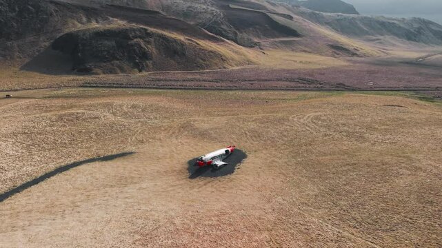 Cinematic 4K Aerial Footage of Abandoned Military Aircraft Wreck in Icelandic Grassland
