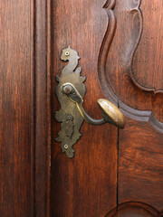 Metal door handle, original shape, bronze color