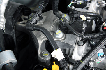 Close-up of the upper engine mount. Fastening the engine to the body. Details of a modern hybrid...