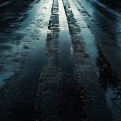 Dark, wet asphalt road surface showing multiple intersecting tire tracks and reflections. Abstract grunge texture representing urban transport or motion.