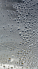 background, unusual, abstract. drops of morning dew, condensation on the glass. wet glass. water drops close-up. beautiful background for text. Spray cool condensate water on the glas