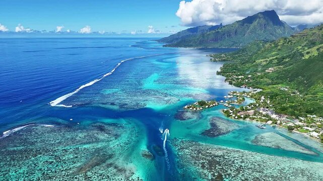 Drone Tahiti. Aerial Moorea island, view of clear water lagoon, boats and tours in French Polynesia. Exotic travel vacation getaway, Famous tourism romantic honeymoon destination. 