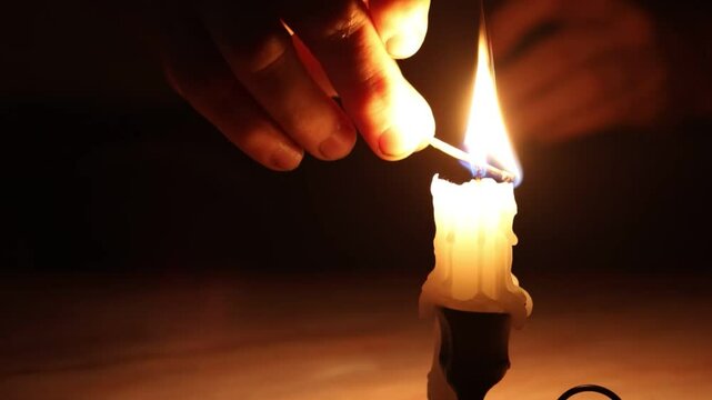 burning match in hand