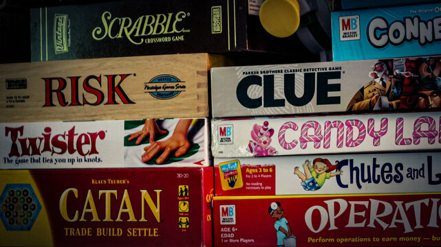 Minneapolis, USA - May 26, 2025: A close-up of of classic and popular board games on a shelf from various brands. Editorial Use Only.