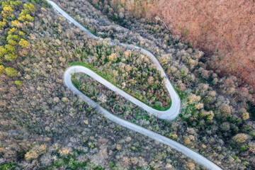 Aerial view from drone of curves of  road. Transportation and infrastructure concept