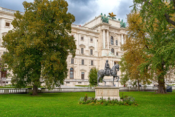 Obraz premium Hofburg Palace in Vienna, Austria, a stunning symbol of imperial power, with its majestic architecture and rich historical significance set against the vibrant city backdrop