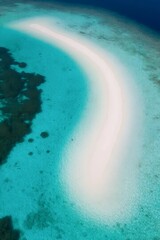 Coastal Serenity: The aerial perspective reveals a mesmerizing sandbank formation nestled in the turquoise embrace of the ocean, with patches of coral reefs surrounding the crescent-shaped sand.