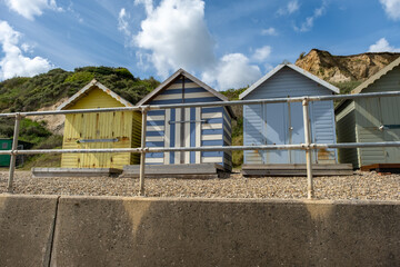 Colourful beach huts along the promenade in the seaside village of Overstrand on the North Norfolk coast