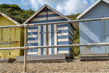Colourful beach huts along the promenade in the seaside village of Overstrand on the North Norfolk coast