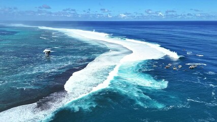 Drone Tahiti 4k. Ocean wave forming. Teahupoo famous surfing action sports destination in Tahiti. surf destination travel in French Polynesia. 4k slow motion.  - Powered by Adobe