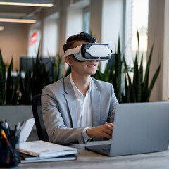 Young professional working with vr headset and laptop in modern office setting