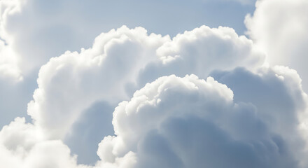 Soft white clouds in a clear blue sky creating a serene atmosphere