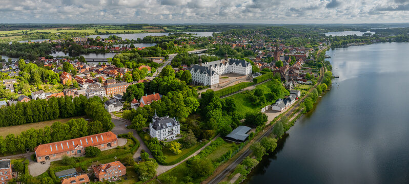 Panorama aerial view of Pl&ouml;n Castle and historic townscape of Pl&ouml;n by the lake Pl&ouml;ner See, Schleswig-Holstein, Germany. Pl&ouml;n and its lake landscape.