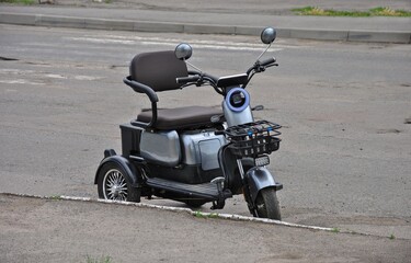 compact city transport three-wheeled electric scooter. environmental and convenient